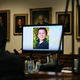 A photo of Sandy Hook victim Jesse Lewis displayed during opening arguments last week. His parents testified in the defamation trial against Alex Jones on Tuesday.